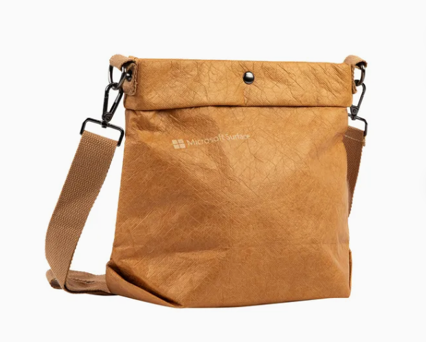 Shiny silver DuPont Tyvek bag, high-tech look, reflective surface, studio lighting
