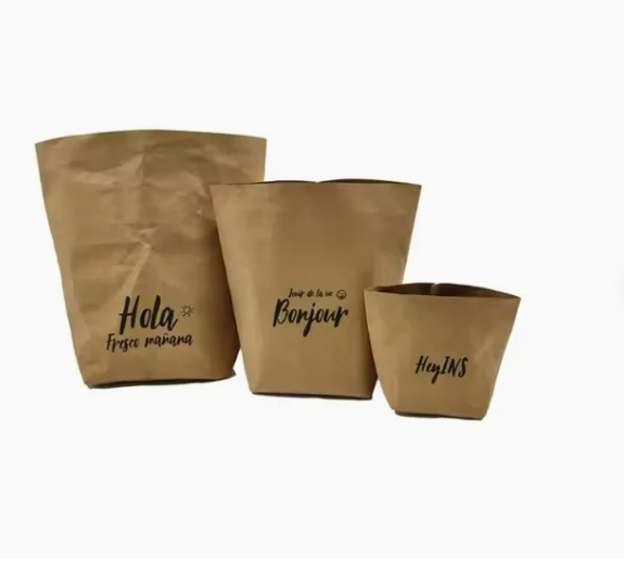 Blue Tyvek drawstring pouch, lightweight, durable, placed on white surface
